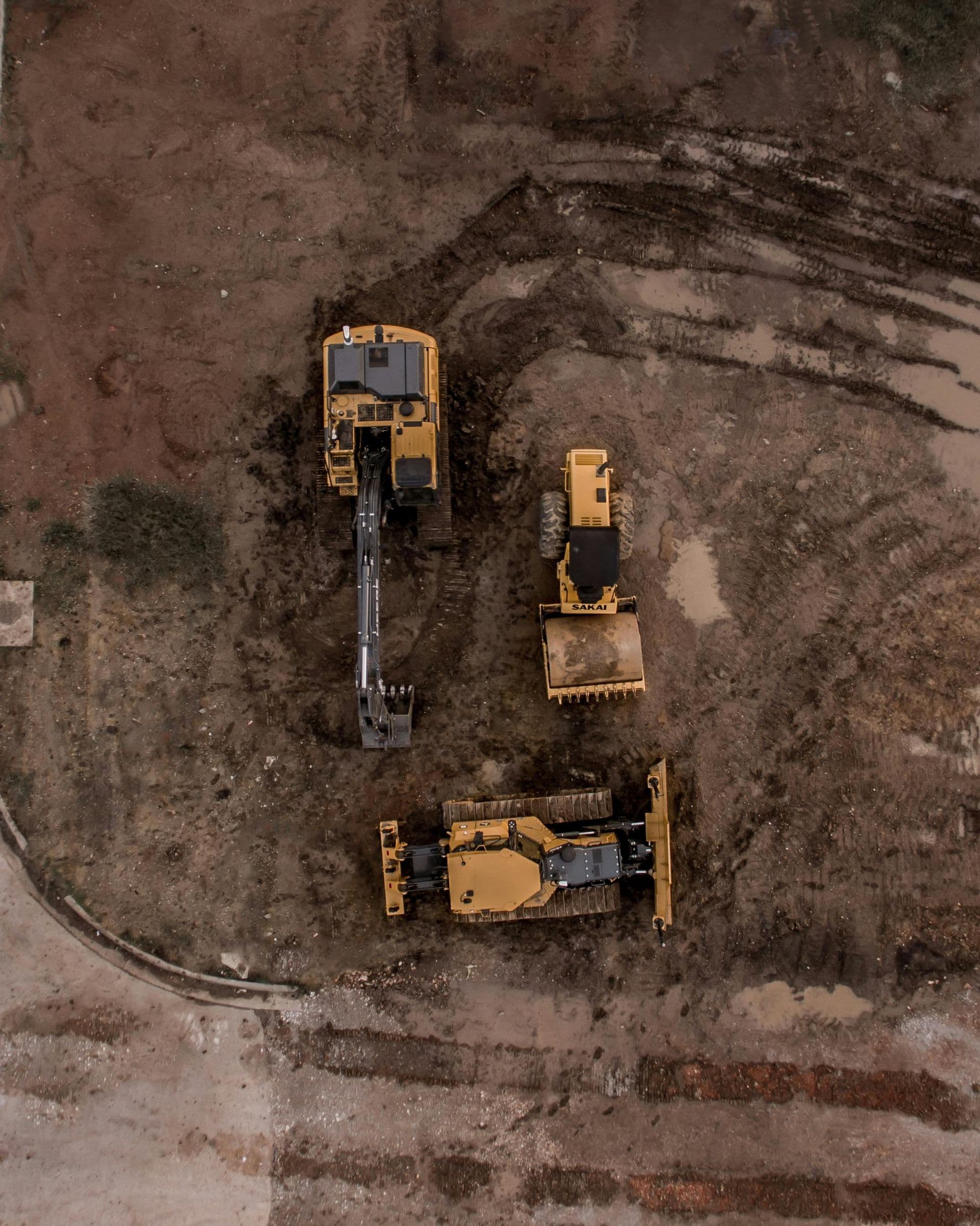 Aerial view of earthmoving equipment preparing a site