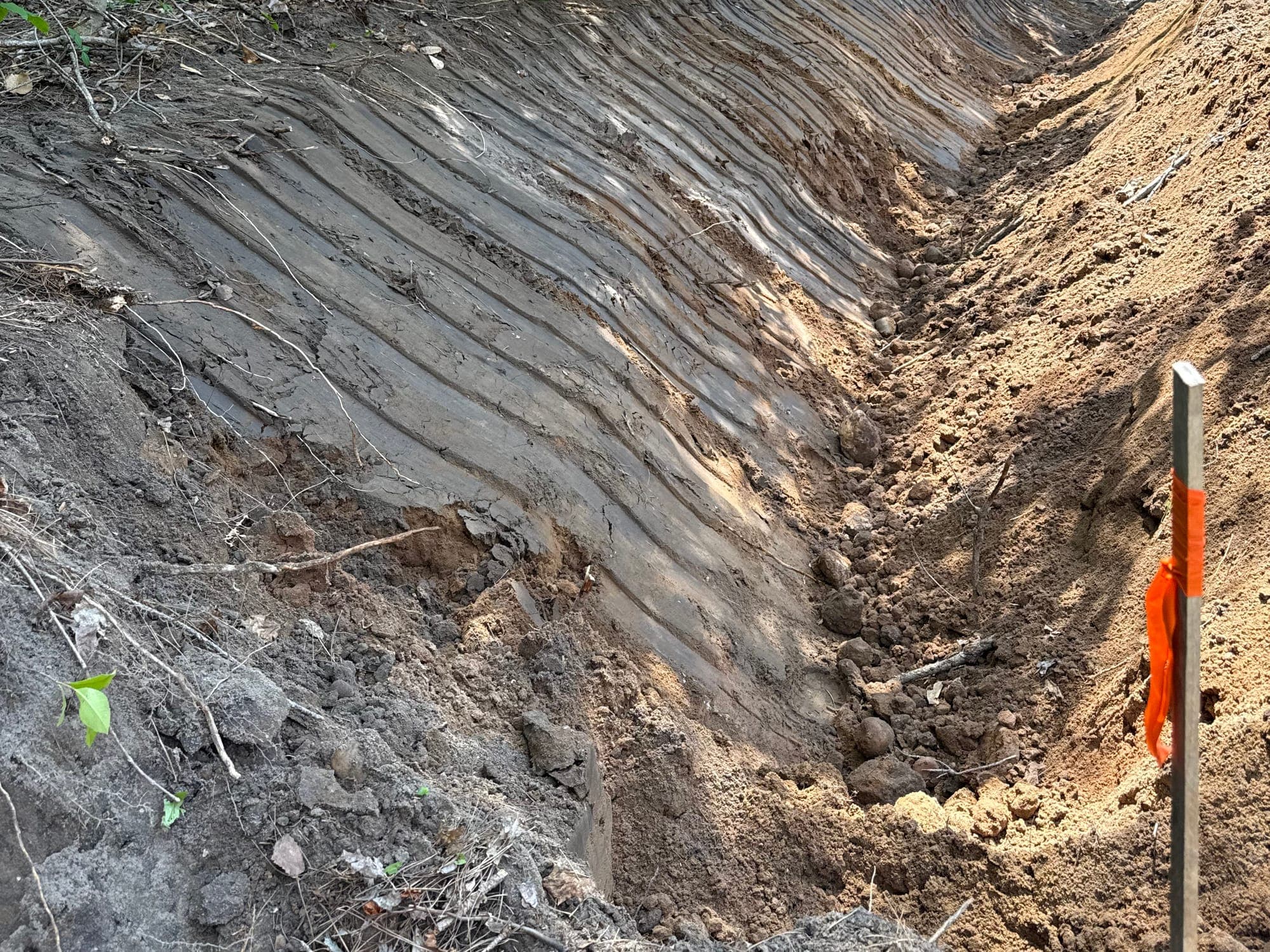 Shaped drainage channel marked to the planned grade