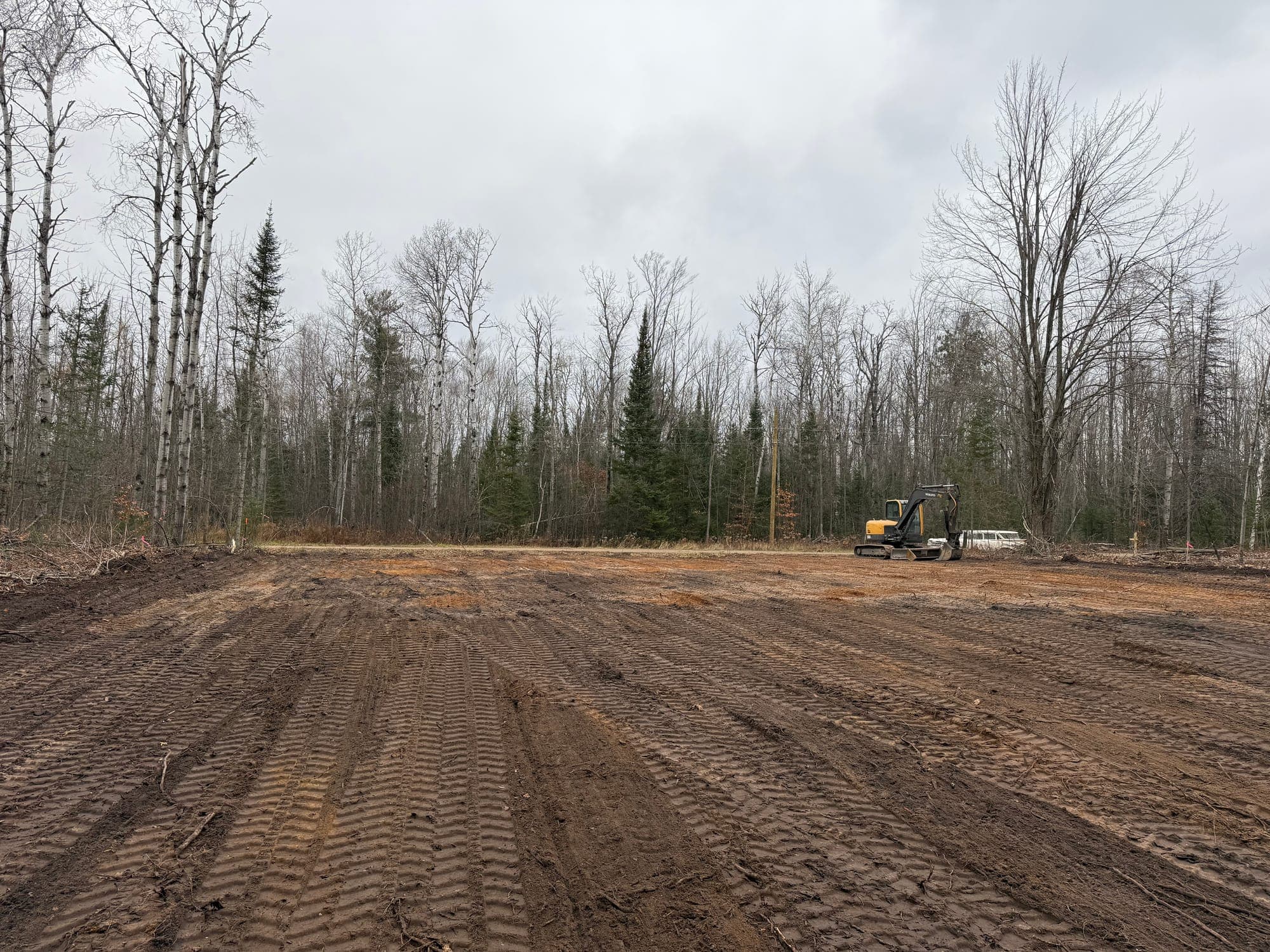 Broad prepared site with a smooth construction-ready grade